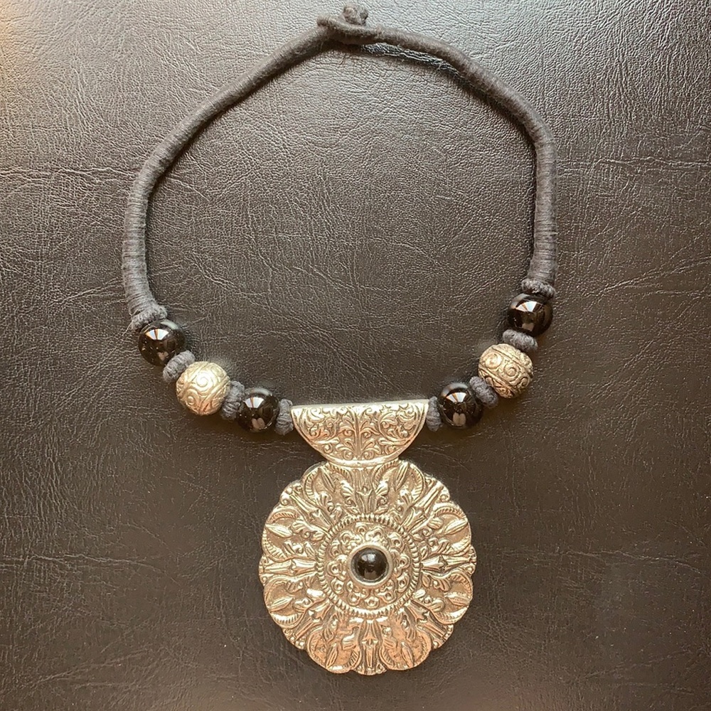 Pendant with large silver medallion